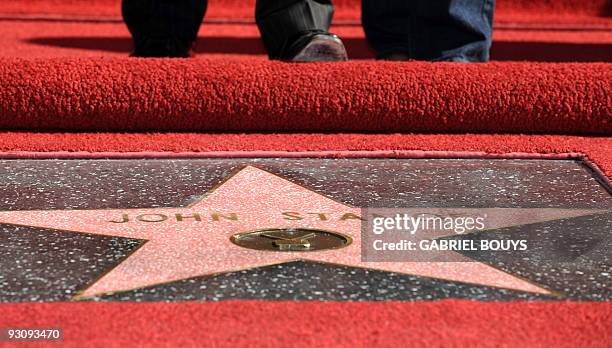 Actor John Stamos poses after being honored with a star on the Hollywood Walk of Fame in Hollywood, California on November 16, 2009. AFP PHOTO /...