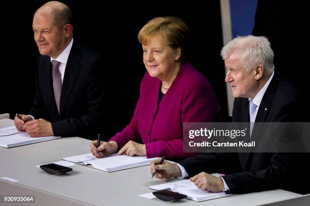 German Chancellor and Chairwoman of the German Christian Democrats Angela Merkel , Acting Chairman of the German Social Democrats Olaf Scholz and...