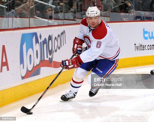 Jaroslav Spacek of the Montreal Canadiens skates the puck around the boards against the Phoenix Coyotes on November 12, 2009 at Jobing.com Arena in...
