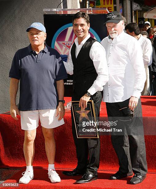 Actor John Stamos with Bruce Johnston and Mike Love of The Beach Boys attend the ceremony honoring Actor John Stamos with a star on the Hollywood...
