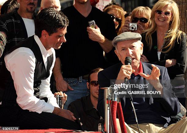 Actor John Stamos listens to Actor Jack Klugman after being honored by a Star on the Hollywood Walk of Fame in Hollywood, California on November 16,...