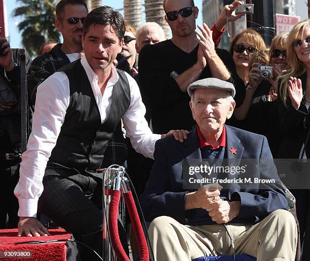 Actor John Stamos and actor Jack Klugman pose during induction ceremony on the Hollywood Walk of Fame on November 16, 2009 in Hollywood, California.