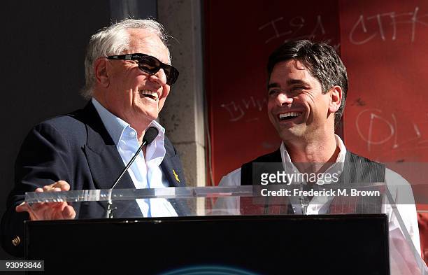 Director Garry Marshall and actor John Stamos speak during the induction ceremony on the Hollywood Walk of Fame on November 16, 2009 in Hollywood,...