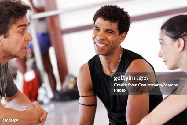 Cuban dancer Carlos Acosta shares a laugh with Russian ballet teacher Sergei Polunin and Tamara Rojo from Spain, as the Royal ballet rehearses...