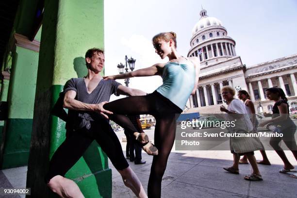 Edward Watson and sarah Lambo, dancers of the Royal Ballet pose for picture in front of Havana's Capitolio landmark, on July 16 in Havana, Cuba. With...