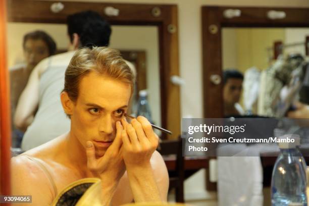 Edward Watson of the Royal ballet puts on his make-up prior to his performance in the Gran Teatro, on July 15 in Havana, Cuba. With its first visit...