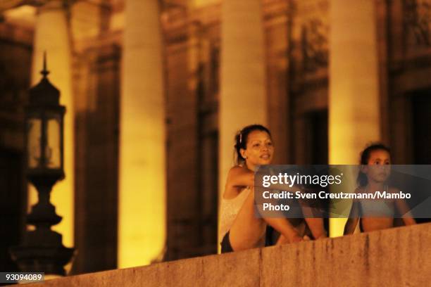 Cubans watch the Royal Ballet "Chroma" performance on three big screens outside the Capitolio, on July 15 in Havana, Cuba. With its first visit to...