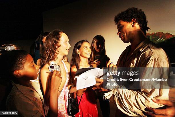 Cuba's Carlos Acosta of the Royal Ballet signs autographs after the performance of "Manon" in the Karl Marx theatre on July 18 in Havana, Cuba....