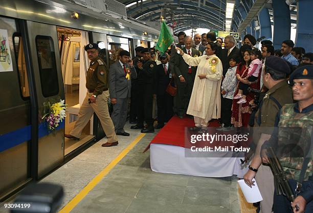Uttar Pradesh Chief Minister Mayawati flags off the metro from Noida City Centre station, as Delhi Metro Rail Coorporation Managing Director...