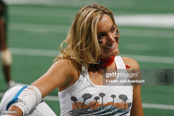 Julie Ginther of the Miami Caliente smiles at fans while warming up prior to the game against the New York Majesty on November 13, 2009 at the...