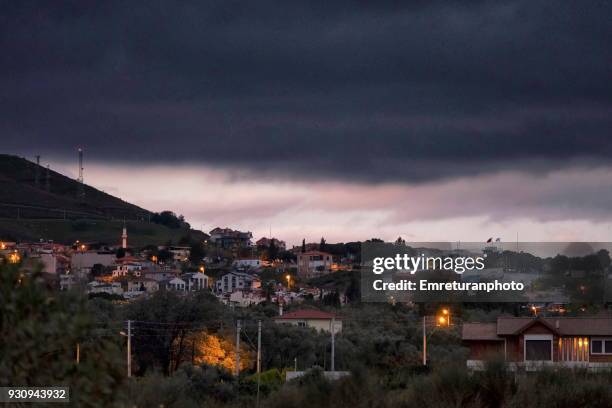 dark clouds over town just before rain. - izmir sunrise stock pictures, royalty-free photos & images