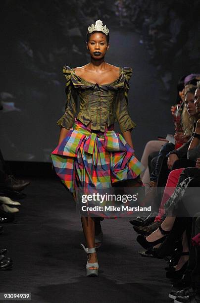 Tolula Adeyemi walks down the runway at the Anglomania show by Vivienne Westwood at Selfridges on November 16, 2009 in London, England.