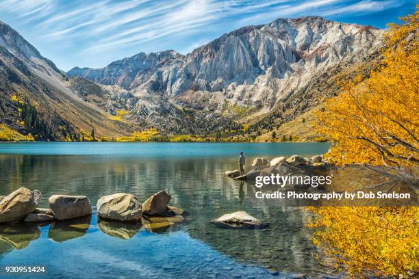 fishing on convict lake in autumn, eastern sierra california - bishop stock pictures, royalty-free photos & images