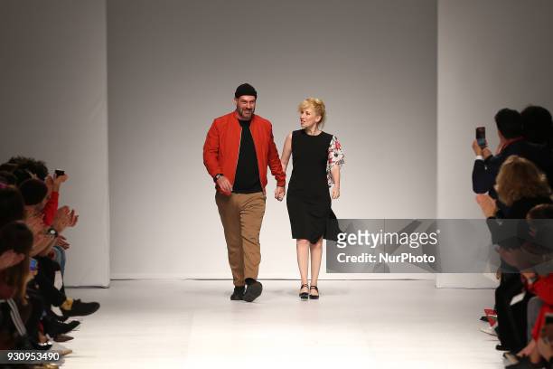 Portuguese fashion designer Ricardo Preto acknowledges cheers after presenting the Fall / Winter 2018 - 2019 collection runway show at the 50 edition...
