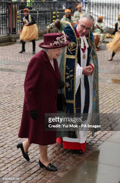 Queen Elizabeth II with Dr John Hall, the Dean of Westminster as she arrives for the Commonwealth Service at Westminster Abbey, London.