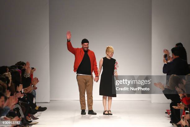 Portuguese fashion designer Ricardo Preto acknowledges cheers after presenting the Fall / Winter 2018 - 2019 collection runway show at the 50 edition...