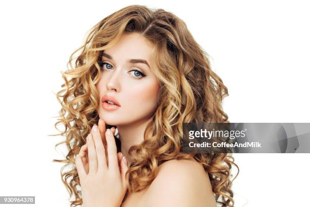 blonde woman fashion model posing against black background - curly blonde hair stock pictures, royalty-free photos & images