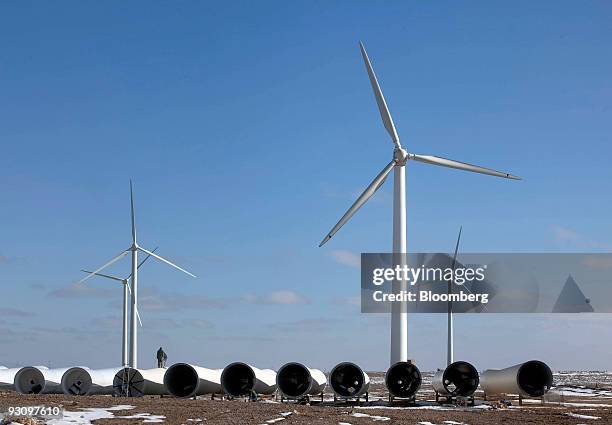 Wind turbine parts are gathered in a field in Yumen, Gansu province, China, on Friday, Nov. 13, 2009. China is under pressure from the international...