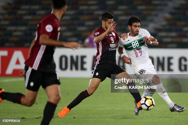 Zob Ahan's midfielder Hamid Bou Hamdan is dispossessed by Al-Wahda's forward Mourad Batna during the AFC Asian Champions League group B football...