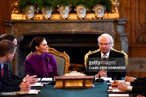 Crown Princess Victoria of Sweden and King Carl XVI Gustaf are pictured during the cabinet meeting at the Stockholm Castle, where the name of...
