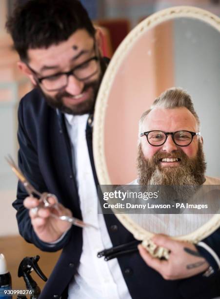 Glen Daniels admires his beard after being styled by award winning master barber Yucel Olmezkaya has he attends day two of Yorkshire Beard Days 2018...