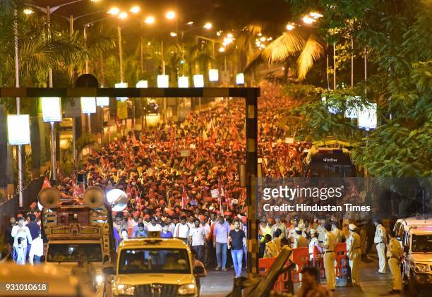Sea of farmers moving in midnight towards Azad Maidan so as not to cause inconvenience to the students appearing for their exams on March 12, 2018 in...