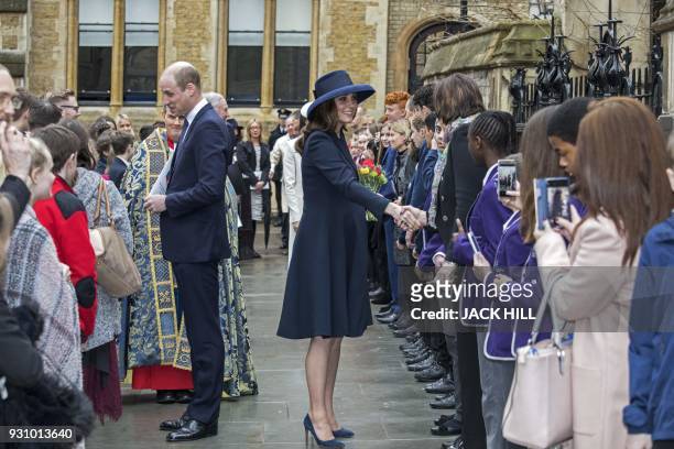 Britain's Prince William, Duke of Cambridge, and Britain's Catherine, Duchess of Cambridge meet school children in the Dean's yard before attending a...
