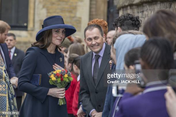 Britain's Catherine, Duchess of Cambridge meets school children in the Dean's yard before attending a Reception in central London, on March 12, 2018....