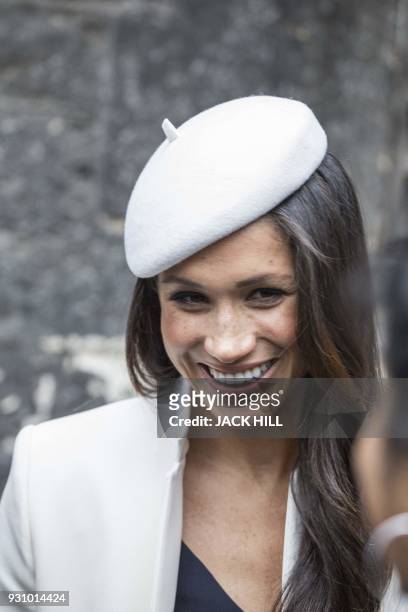 Prince Harry's fiancee, US actress Meghan Markle meets school children in the Dean's yard before attending a Reception in central London, on March...