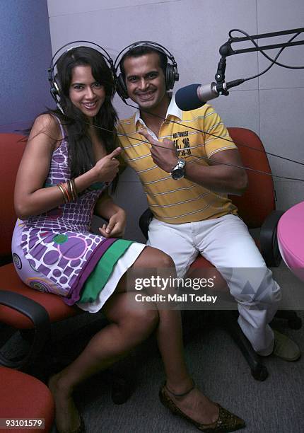 Bollywood actress Sameera Reddy with Meow FM RJ Siddharth Kanan at the studio of the radio station in Mumbai on Saturday, November 14, 2009.