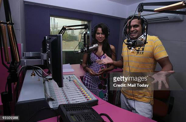 Bollywood actress Sameera Reddy with Meow FM RJ Siddharth Kanan at the studio of the radio station in Mumbai on Saturday, November 14, 2009.