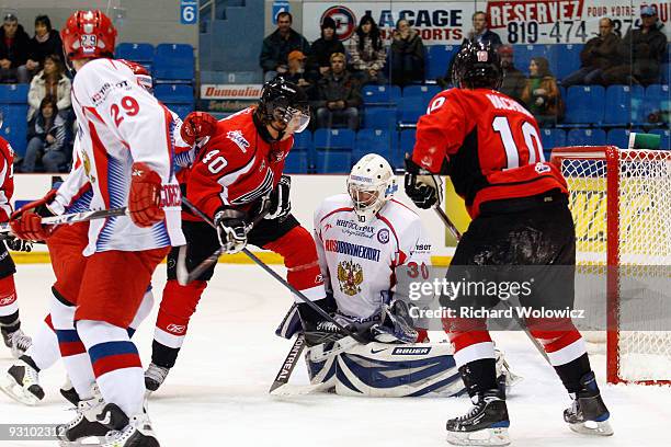 Gabriel Dumont of the QMJHL All-Stars attempts to defect a shot in front of Alexander Zalivin of the Russia All-Stars during Game 1 of the 2009...