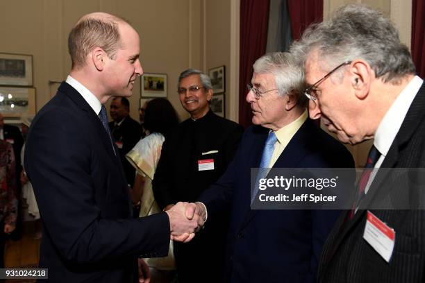 Prince William, Duke of Cambridge meets with former British Prime Minister John Major as they attend the 2018 Commonwealth Day reception at...