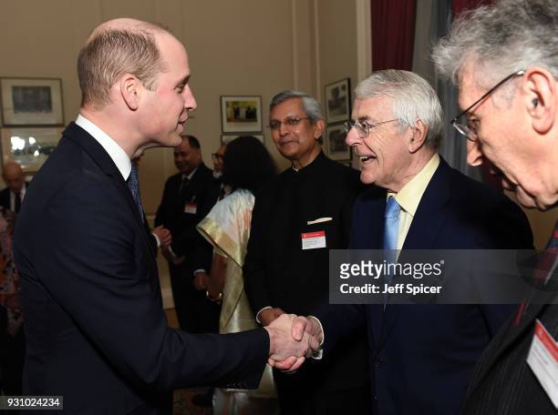 Prince William, Duke of Cambridge meets with former British Prime Minister John Major as they attend the 2018 Commonwealth Day reception at...