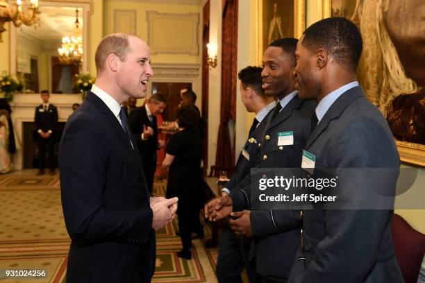 Prince William, Duke of Cambridge talks with guests as he attends the 2018 Commonwealth Day reception at Marlborough House on March 12, 2018 in...