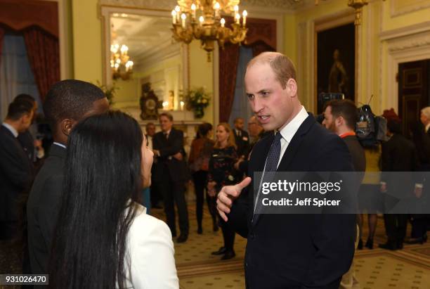 Prince William, Duke of Cambridge talks with guests as he attends the 2018 Commonwealth Day reception at Marlborough House on March 12, 2018 in...