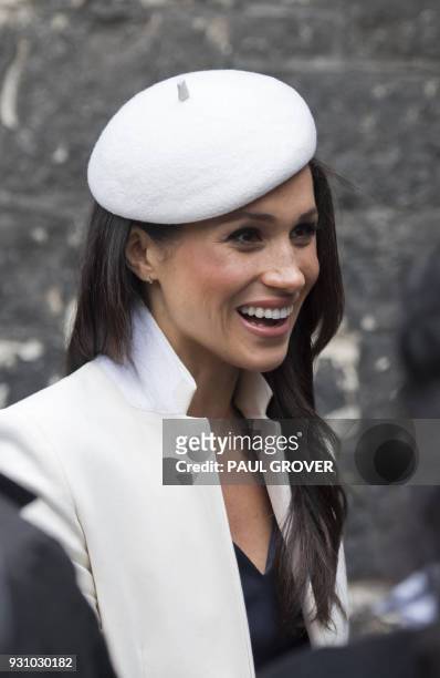 Prince Harry's fiancee, US actress Meghan Markle meets school children in the Dean's yard before attending a Reception in central London, on March...