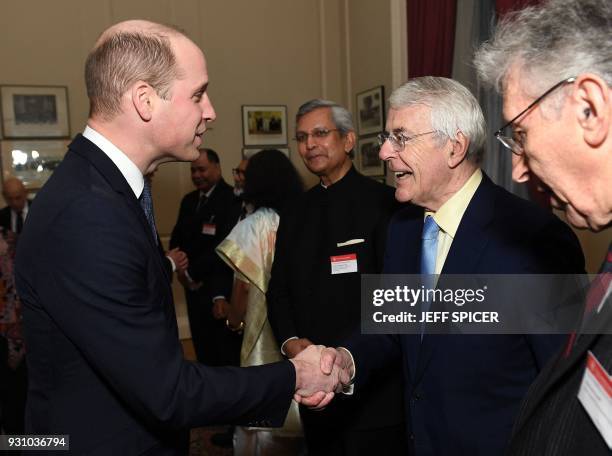 Britain's Prince William, Duke of Cambridge , meets Former British Conservative Prime Minister John Major at the 2018 Commonwealth Day reception at...