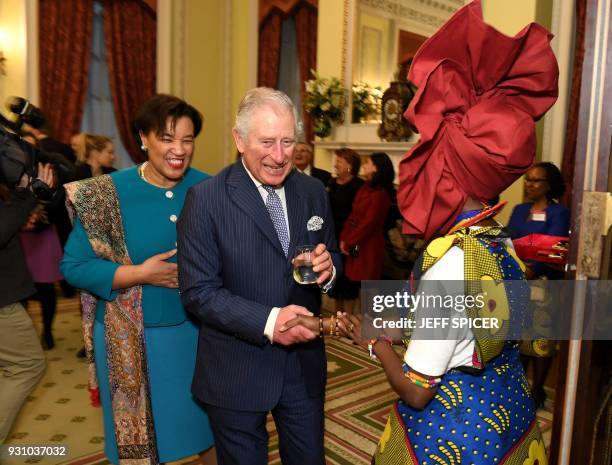 Baroness Patricia Scotland, the Commonwealth Secretary-General and Britain's Prince Charles, Prince of Wales , meet guests at the 2018 Commonwealth...