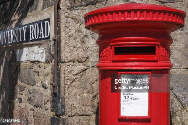 red mailbox at the corner of the campus - buzones fotografías e imágenes de stock