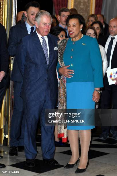 Baroness Patricia Scotland, the Commonwealth Secretary-General speaks with Britain's Prince Charles, Prince of Wales at the Commonwealth Fashion...