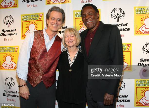 Bobby Shriver and Rafer Johnson arrive at A Very Special Christmas Party at the Shrivers' on November 16, 2009 in Santa Monica, California.