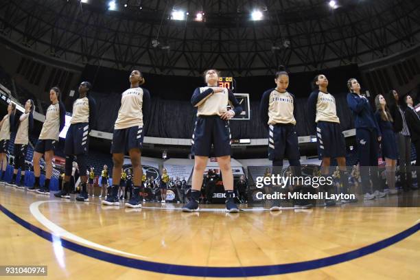 The George Washington Colonials line up for the National Anthem before the semifinal of the Atlantic-10 Women's Basketball Tournament against the...