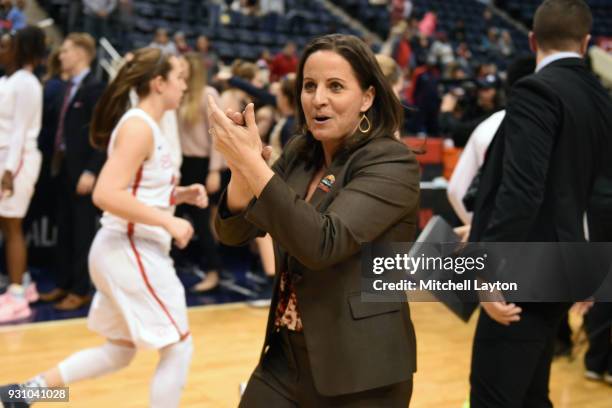 Head coach Jennifer Rizzotti of the George Washington Colonials celebrates a win after the semifinal round of the Atlantic-10 Women's Basketball...