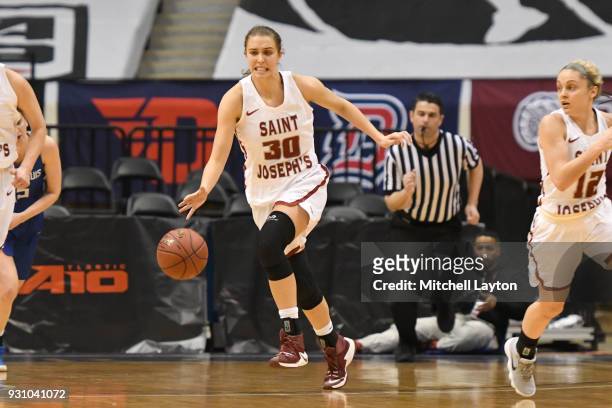 Sarah Veilleux of the St. Joseph's Hawks dribbles up court during the semifinal round of the Atlantic-10 Women's Basketball Tournament against the...