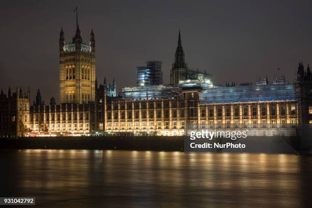 View of Palace of Westminster in London, UK, on 20 February 2018. Houses of Parliament. It hosts the two houses of Parliament of the United Kingdom,...