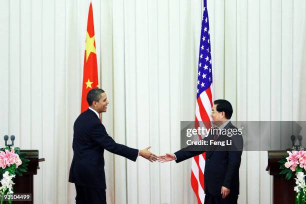 President Barack Obama shakes hands with Chinese President Hu Jintaoafter a joint press conference at the Great Hall of People on November 17, 2009...