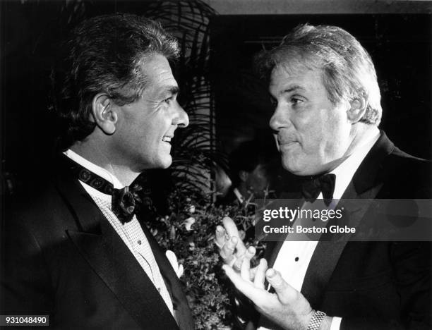 Boston businessmen Charles Sarkis, of Westwood, and Joe O'Donnell, of Belmont, talk at the Wang Restoration Ball in Boston on Nov. 8, 1991.