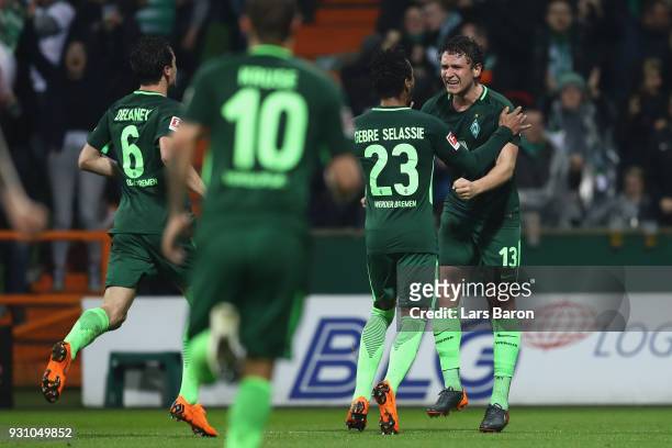 Milos Veljkovic of Bremen celebrates his team's first goal with team mates during the Bundesliga match between SV Werder Bremen and 1. FC Koeln at...
