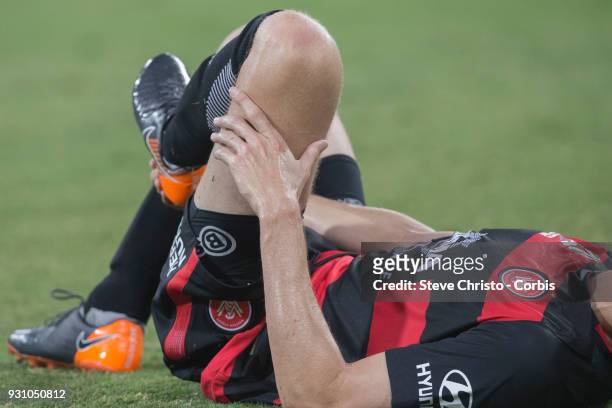 Michael Thwaite of the Wanderers holds his ankle during the round 22 A-League match between the Western Sydney Wanderers and the Wellington Phoenix...